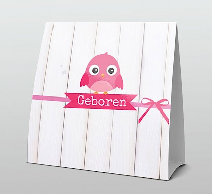Roze vogeltje op roze lintje met hout Roze vogeltje op roze lintje met hout