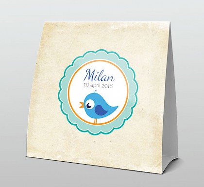 Blauw vogeltje in rond kader op oud papier